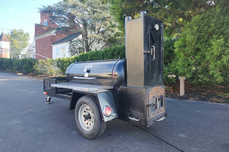 Used Meadow Creek TS120 Tank Smoker With Live Smoke, Insulated Firebox, Stainless Steel Exterior Shelves & Extra Grate in Warming Box