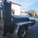 Used Meadow Creek TS120 Tank Smoker With Live Smoke, Insulated Firebox, Stainless Steel Exterior Shelves & Extra Grate in Warming Box