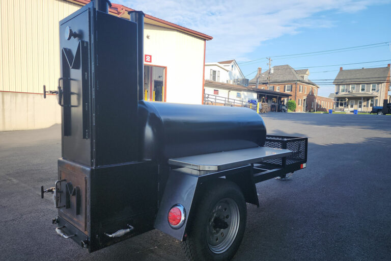 Used Meadow Creek TS120 Tank Smoker With Live Smoke, Insulated Firebox, Stainless Steel Exterior Shelves & Extra Grate in Warming Box