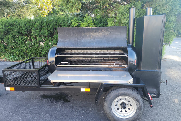 Used Meadow Creek TS120 Tank Smoker With Live Smoke, Insulated Firebox, Stainless Steel Exterior Shelves & Extra Grate in Warming Box